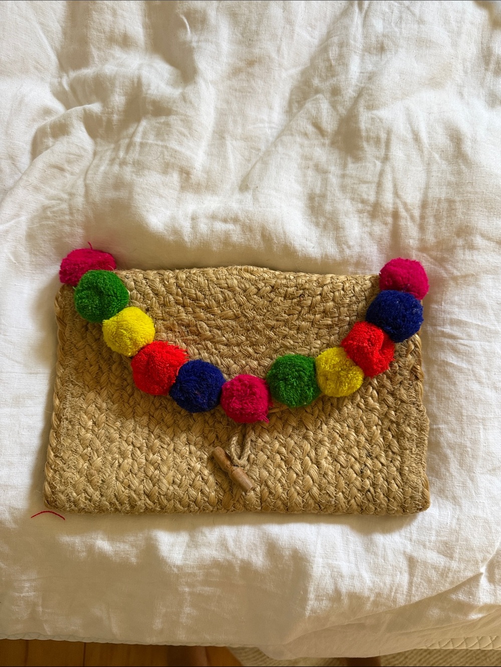 Woven Straw Clutch with Multicolor Pom-Pom Trim